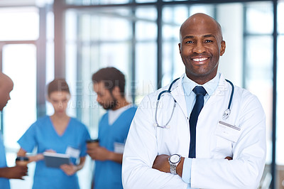 Buy stock photo Leader, man and portrait of doctor in hospital, healthcare or clinic with medical expert nurses to trust in quality care. Black man, medicine and happy neurosurgeon with arms crossed in confidence