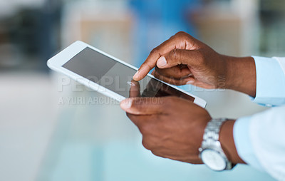Buy stock photo Closeup shot of an unrecognizable doctor using a digital tablet