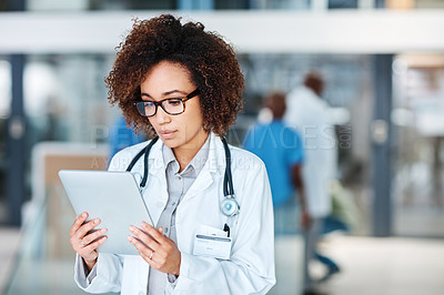 Buy stock photo Healthcare, reading and doctor with tablet for research, telehealth and online results in hospital. Medical specialist, technology or woman in lobby for internet, feedback and communication in clinic