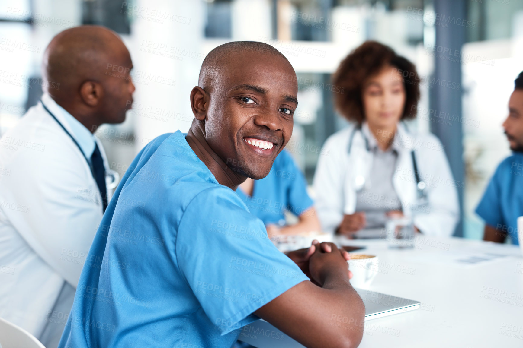 Buy stock photo Man, healthcare worker and portrait with smile, pride and diversity for team, meeting or feedback. Group of people, doctors and collaboration for consulting, help and medicine in clinic or hospital