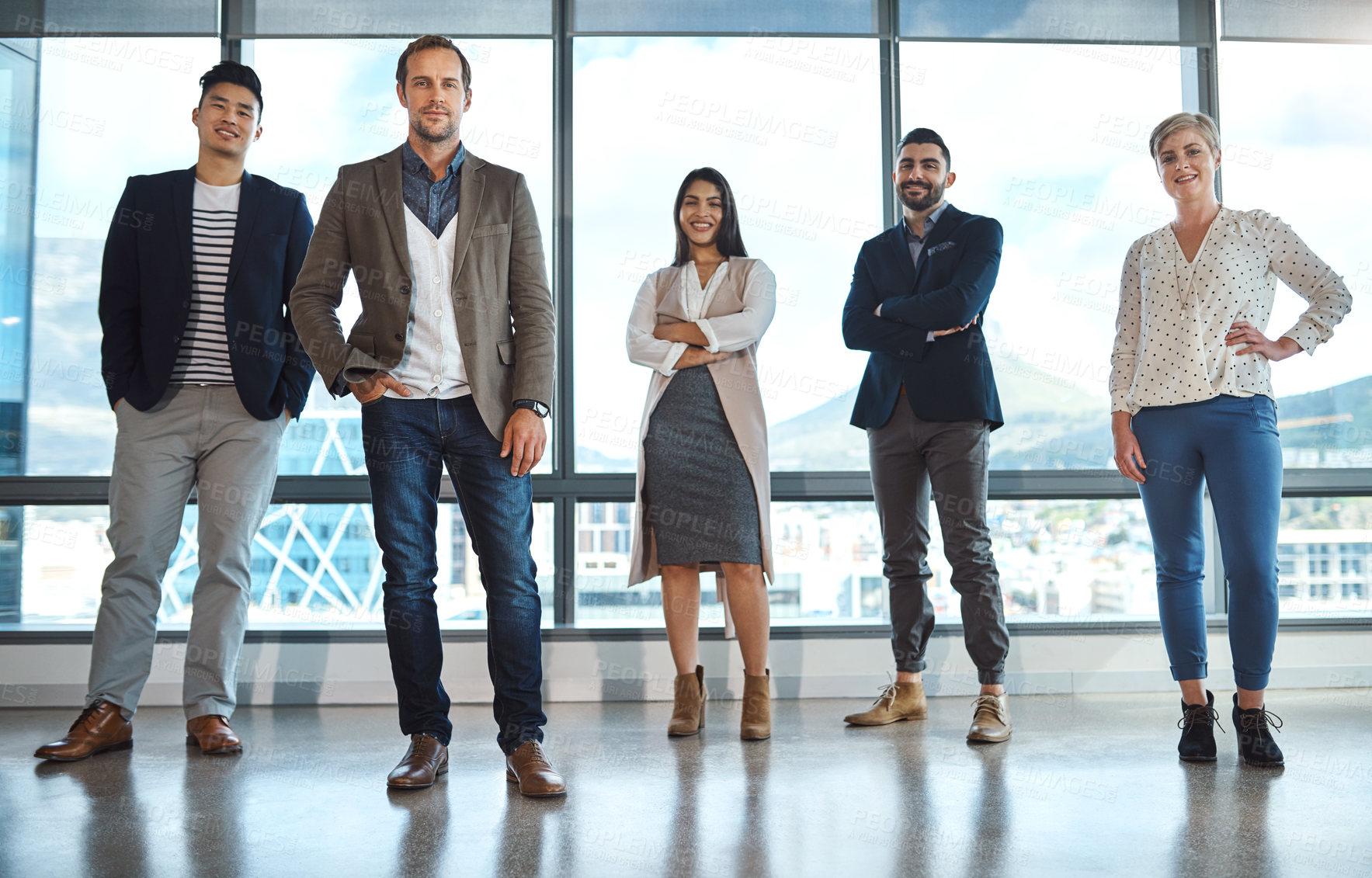 Buy stock photo Portrait of a diverse group of businesspeople standing in an office