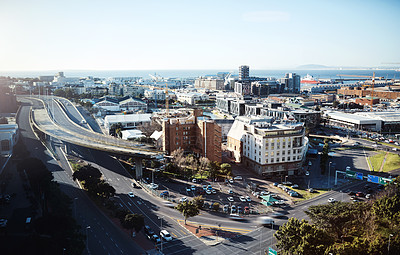 Buy stock photo City, skyline and travel outdoor with infrastructure, view and cityscape with street, traffic and sea. Skyscraper, architecture and Cape Town above with urban roads, building and ocean in summer