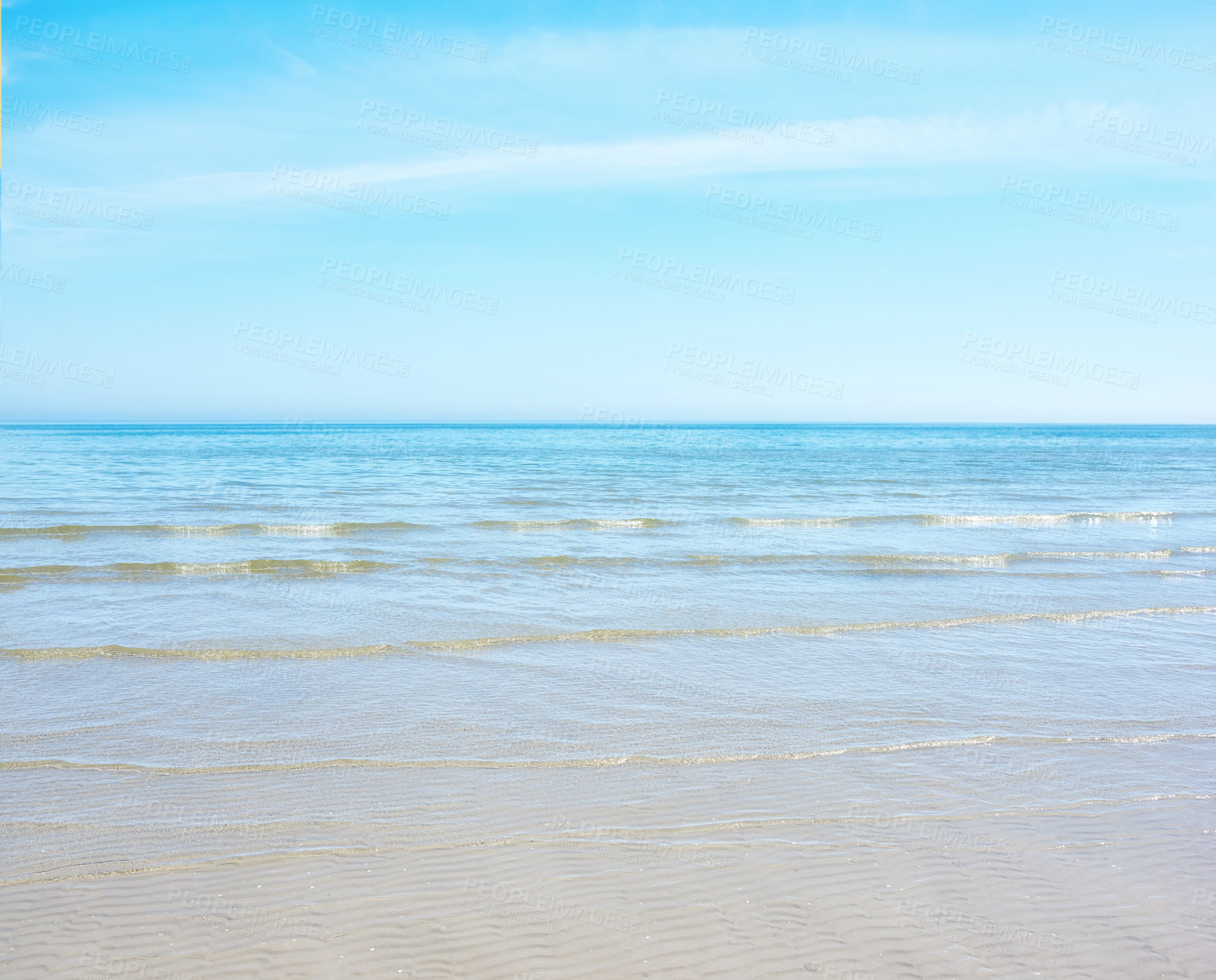 Buy stock photo Copy space at the beach with a blue sky background above the horizon. Calm ocean waves across an empty sea along the sandy shore. Peaceful and tranquil landscape for a relaxing and zen summer holiday