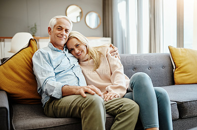 Buy stock photo Shot of a happy mature couple relaxing on the sofa at home