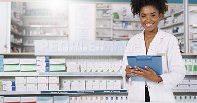 Buy stock photo Cropped portrait of an attractive young pharmacist standing with a file in her hands in a chemist
