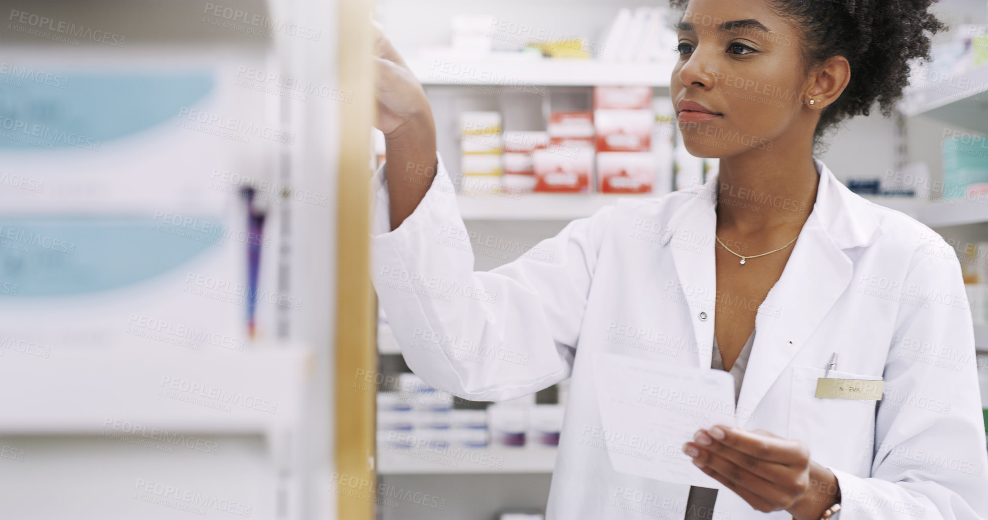 Buy stock photo Black woman, pharmacist and checking shelf with prescription for medication or pharmaceuticals at pharmacy. Young African, female person or medical employee looking for drugs on checklist at store