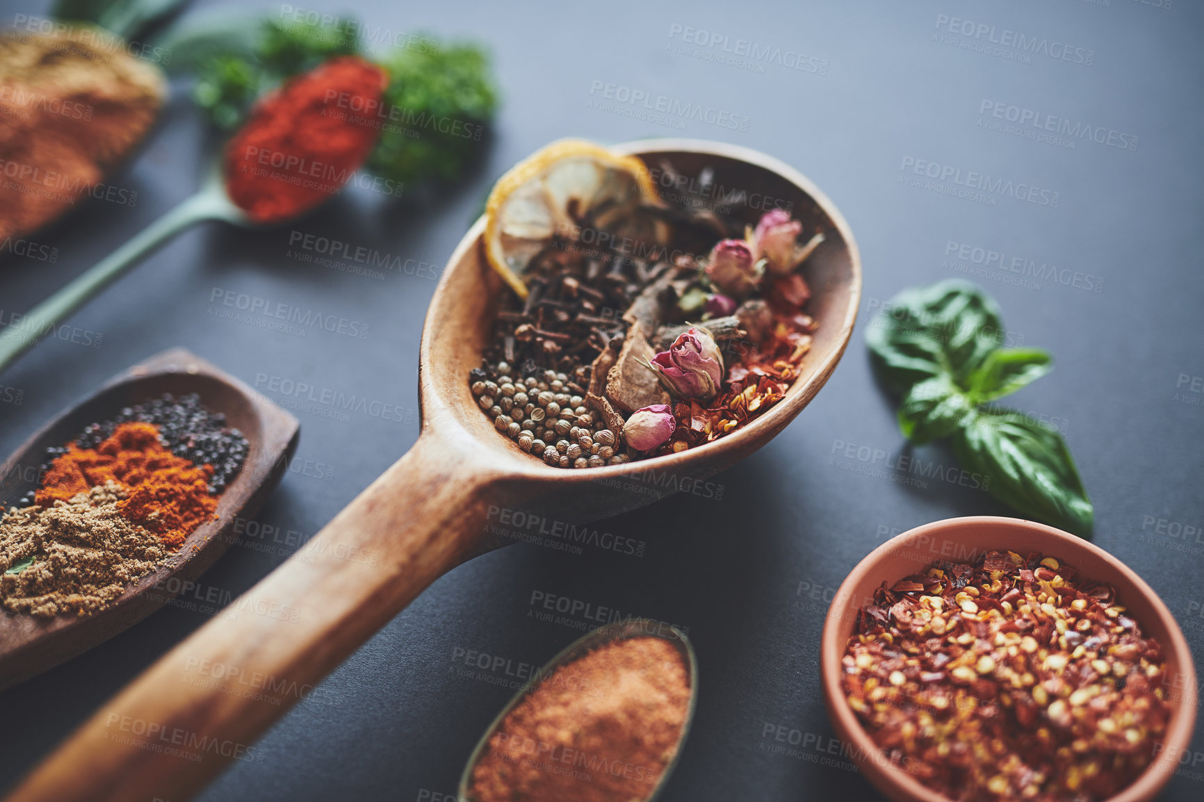 Buy stock photo Table, spoons and group of spices in abstract, curry and ingredients for flavor on background. Row, seasoning and collection of herbs or organic turmeric, textures and culinary condiments for food