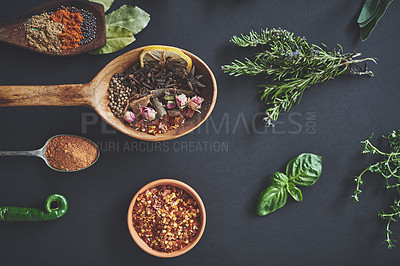 Buy stock photo Table, spoons and group of spices for preparation, curry and ingredients for flavor on background. Row, top view and collection of herbs or organic powder, rosemary and culinary condiments for food