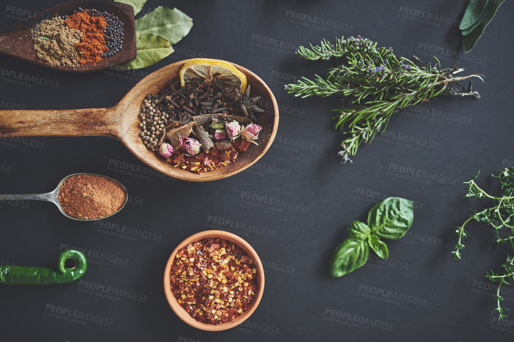 Buy stock photo Table, spoons and group of spices for preparation, curry and ingredients for flavor on background. Row, top view and collection of herbs or organic powder, rosemary and culinary condiments for food