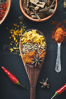 Buy stock photo Cooking, seasoning and diet with spices in studio for aroma, restaurant and flavor. Health, nutrition and above of exotic herbs on black background for turmeric, kitchen and paprika ingredients