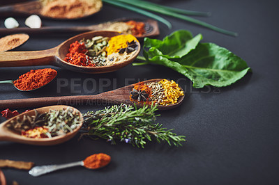 Buy stock photo Kitchen, curry and spices with spoon, cooking or ingredients for flavor with culinary art. Seeds, leaves and above utensils on counter for meal prep, cinnamon and rosemary for food at restaurant