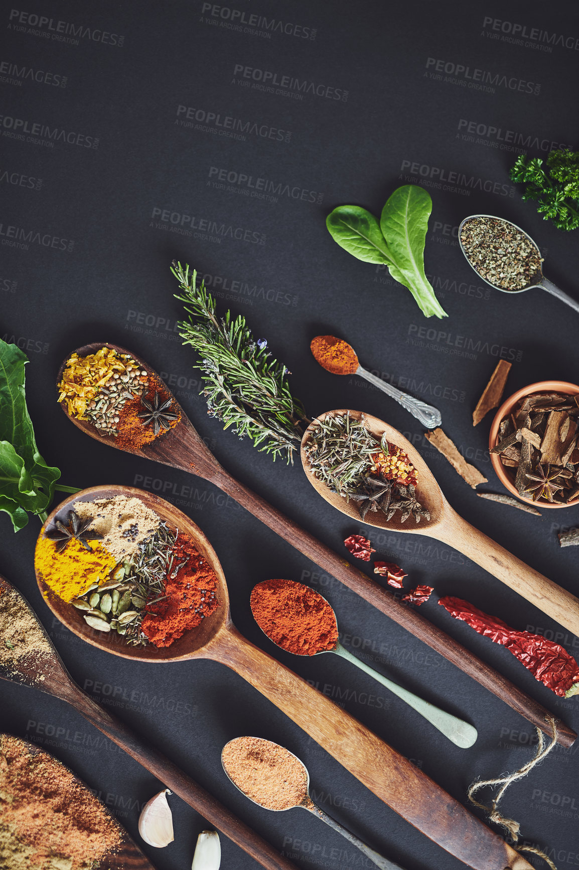 Buy stock photo Kitchen, herbs and spices with spoon for culinary ingredients, flavor and seasoning for cooking. Seeds, leaves and above utensils on table for meal prep, curry and variety for food at restaurant