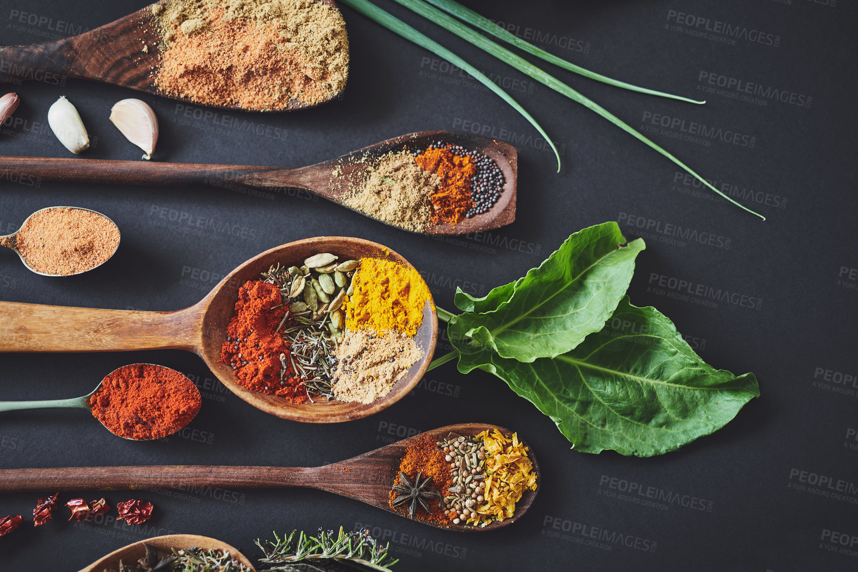 Buy stock photo Kitchen, spices and herbs on counter for culinary ingredients, flavor and seasoning with leaves for cooking. Seeds, powder and above table with meal prep, curry and variety for food at restaurant