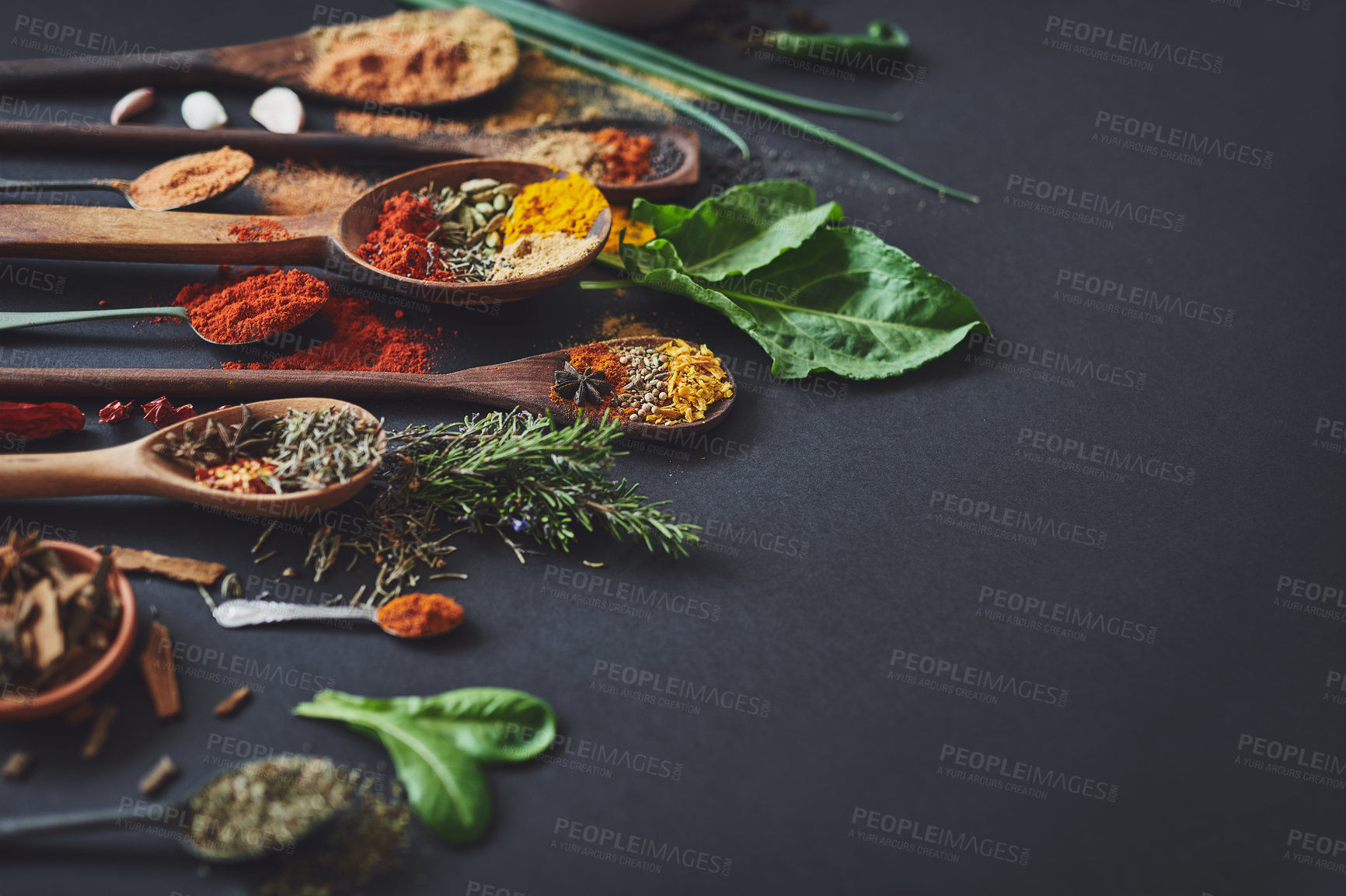 Buy stock photo Kitchen, spices and powder on table for culinary ingredients, flavor and mockup space with leaves for cooking. Seeds, curry and above counter with meal prep, herbs and variety for food at restaurant