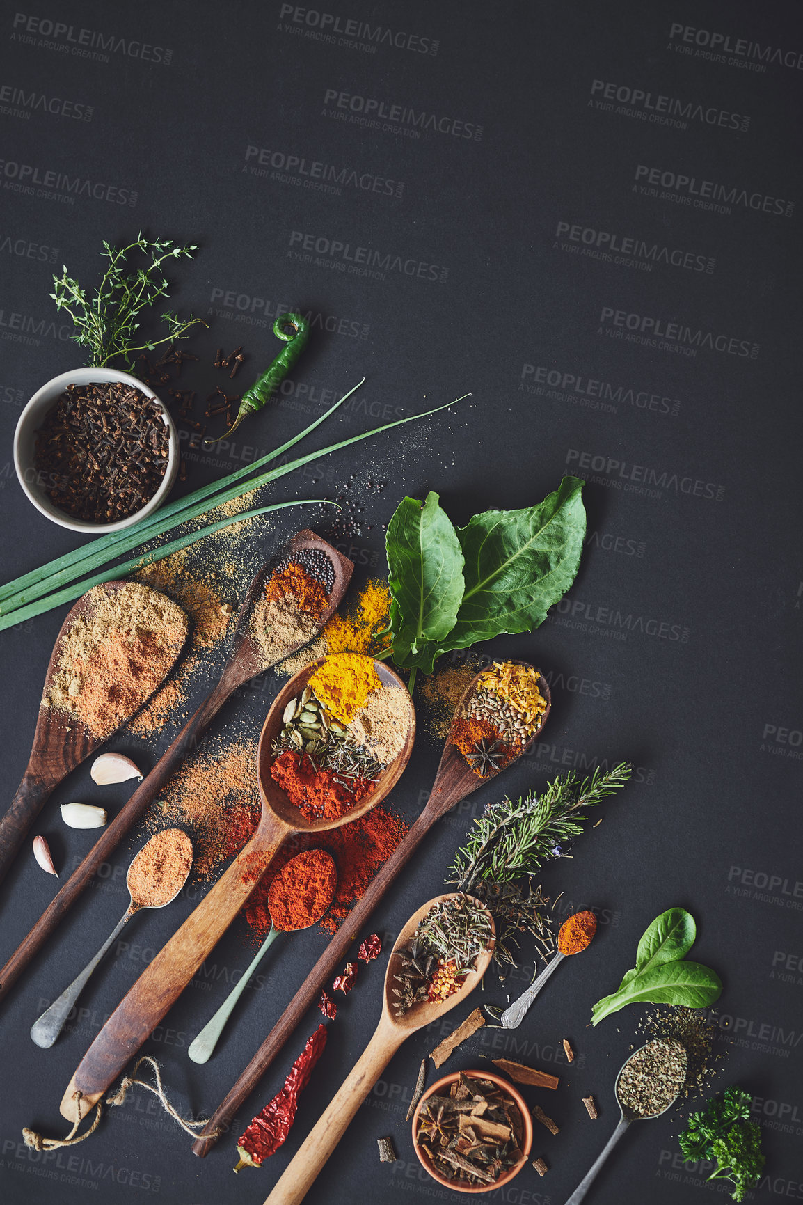 Buy stock photo Kitchen, spices and curry on table for culinary ingredients, flavor and mockup space with leaves for cooking. Seeds, powder and above counter with meal prep, herbs and variety for food at restaurant