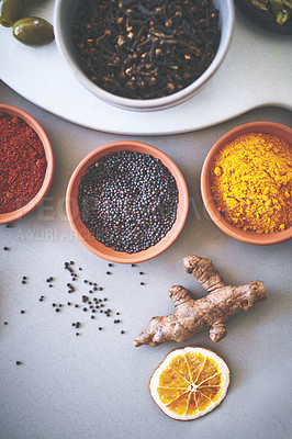 Buy stock photo Bowl, ginger and board in gray background for spices, powder and sensory appeal for creativity with culinary. Studio, condiment and flavor for cooking with ingredients, aroma and seasoning collection