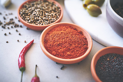 Buy stock photo Assortment, bowl and spices on table for ingredients, powder and board for sensory appeal with culinary. Organic, condiment and flavor for cooking with coriander, black pepper and curry for seasoning