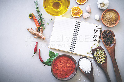 Buy stock photo Ingredient, spices and seasoning by white background with book, inspiration and flavor for cooking technique for culinary. Cookbook, instructions and recipe with condiment of garlic, curry and studio