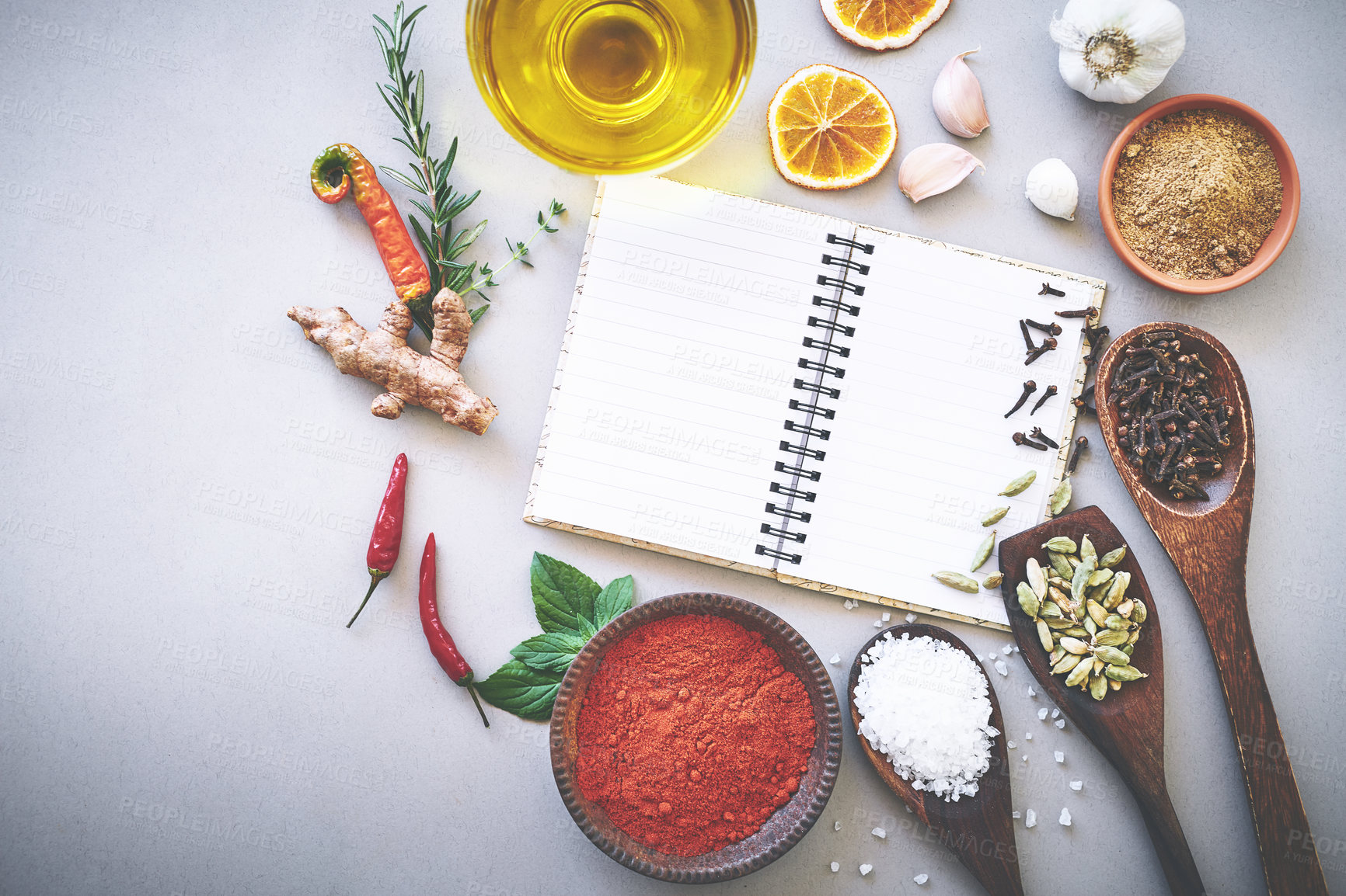 Buy stock photo Ingredient, spices and seasoning by white background with book, inspiration and flavor for cooking technique for culinary. Cookbook, instructions and recipe with condiment of garlic, curry and studio