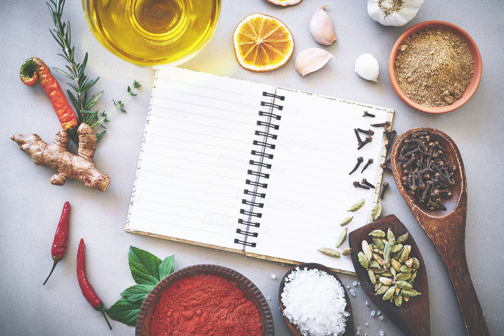 Buy stock photo Herbs, spices and seasoning by white background with book, inspiration and flavor for cooking technique for culinary. Cookbook, instructions and food recipe with condiment of garlic, curry and studio