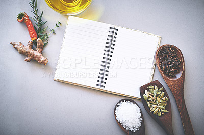 Buy stock photo Recipe, spices and seasoning on table with book, inspiration or new ideas for cooking technique for culinary. Cookbook, instructions or ingredient with condiment of garlic, coriander or salt in spoon