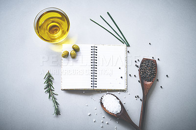 Buy stock photo Recipe, spices and salt by white background with notebook, inspiration and ideas for cooking technique for culinary. Cookbook, instructions and ingredient with condiment of olives, spoon and studio