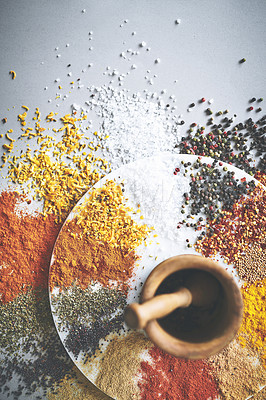 Buy stock photo Mortar, pestle and spices in white background for colorful, seasoning and sensory appeal for creativity with culinary. Studio, condiment and flavor for cooking with herbs, powder and ingredients