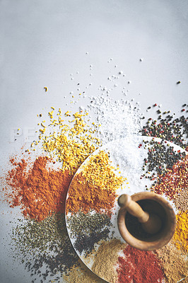 Buy stock photo Mortar, collection and spices in white background for cooking, powder and sensory appeal for creativity. Studio, mockup space or seasoning for flavor with curry, condiment or ingredients for culinary