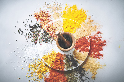 Buy stock photo Mortar, pestle and spices in white background for collection, flavor and sensory appeal for creativity. Studio, powder and seasoning for cooking with curry, condiment and ingredients for culinary