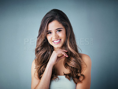 Buy stock photo Hair care, portrait and woman in studio with smile for keratin treatment, shampoo or on gray background. Salon, aesthetic and model with cosmetics for natural glow, satisfaction or healthy texture