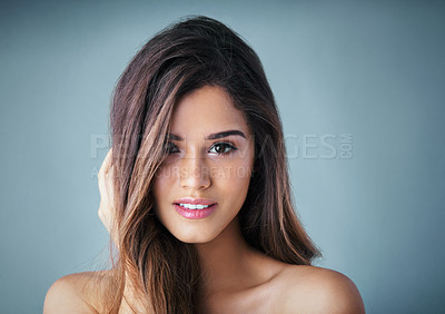 Buy stock photo Attractive woman, portrait and beauty with makeup for haircare, cosmetics or skincare on a gray studio background. Young face, female person or model with smile for facial, cosmetology or dermatology