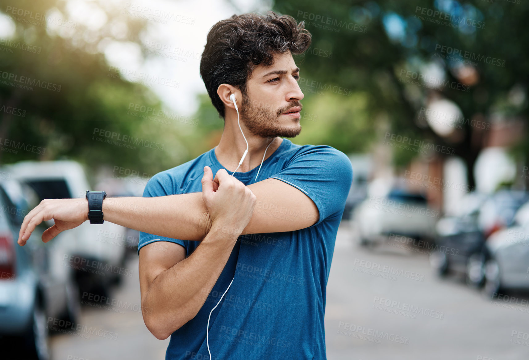 Buy stock photo Man, street and fitness stretching or arm, muscle preparation and cardio exercise with runner or athlete. Earphones, audio tech and music for streaming online, body wellness and morning routine