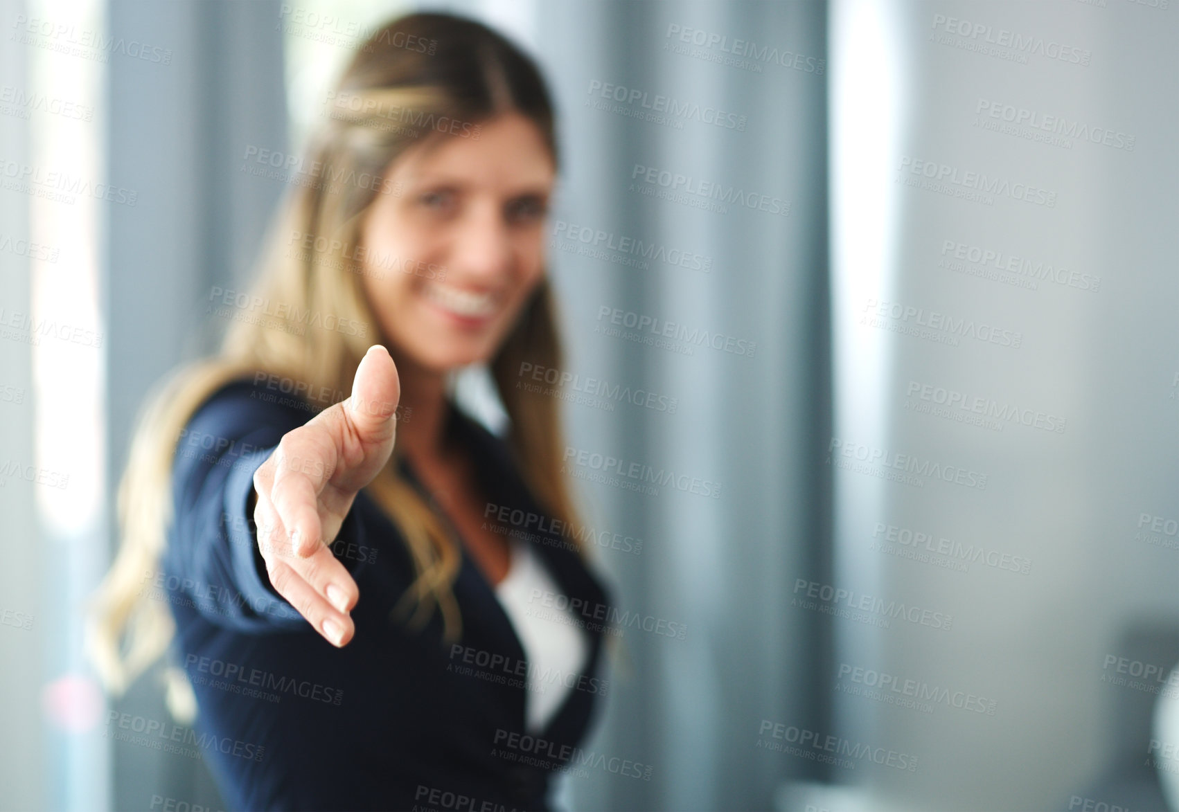 Buy stock photo Cropped shot of a businesswoman reaching for a handshake
