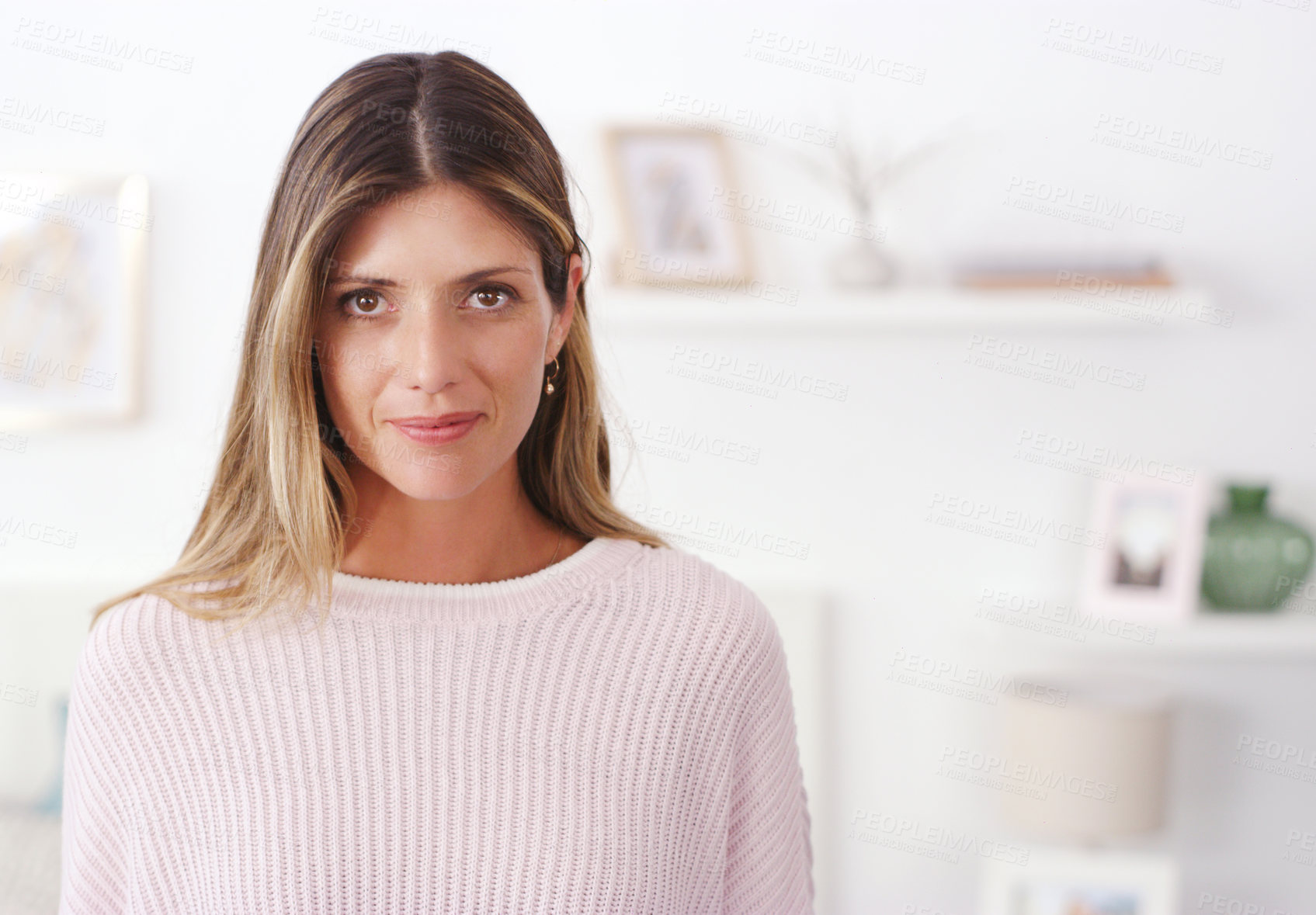 Buy stock photo Cropped shot of an attractive young woman spending the day at home