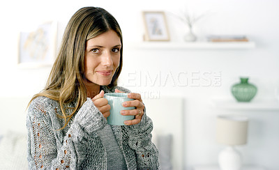 Buy stock photo Cropped shot of a woman enjoying a cup of coffee at home