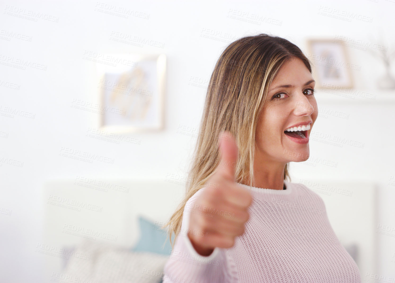 Buy stock photo Cropped shot of an attractive woman showing thumbs up