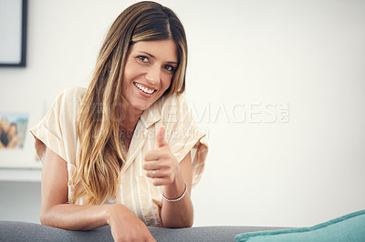 Buy stock photo Cropped shot of an attractive woman showing thumbs up