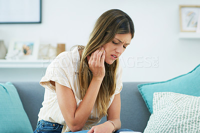 Buy stock photo Cropped shot of an attractive woman experiencing a toothache