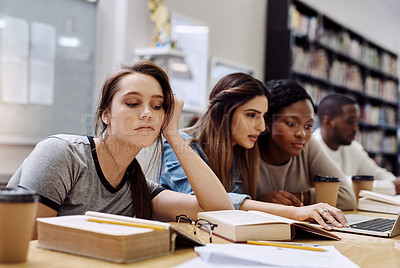 Buy stock photo Bored, burnout and face of unhappy student with books in library for education, learning or study. Annoyed. exhausted and tired with face of girl at desk of college or university for classroom lesson