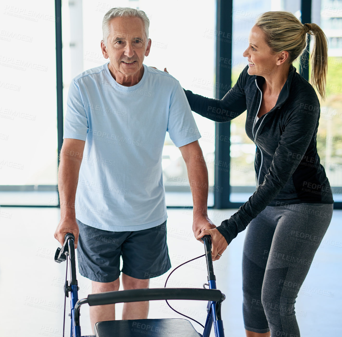 Buy stock photo Woman, physiotherapist and senior patient with walker for exercise, practice or training at fitness center. People, physiotherapy or physical therapy with coach or person with a disability at clinic