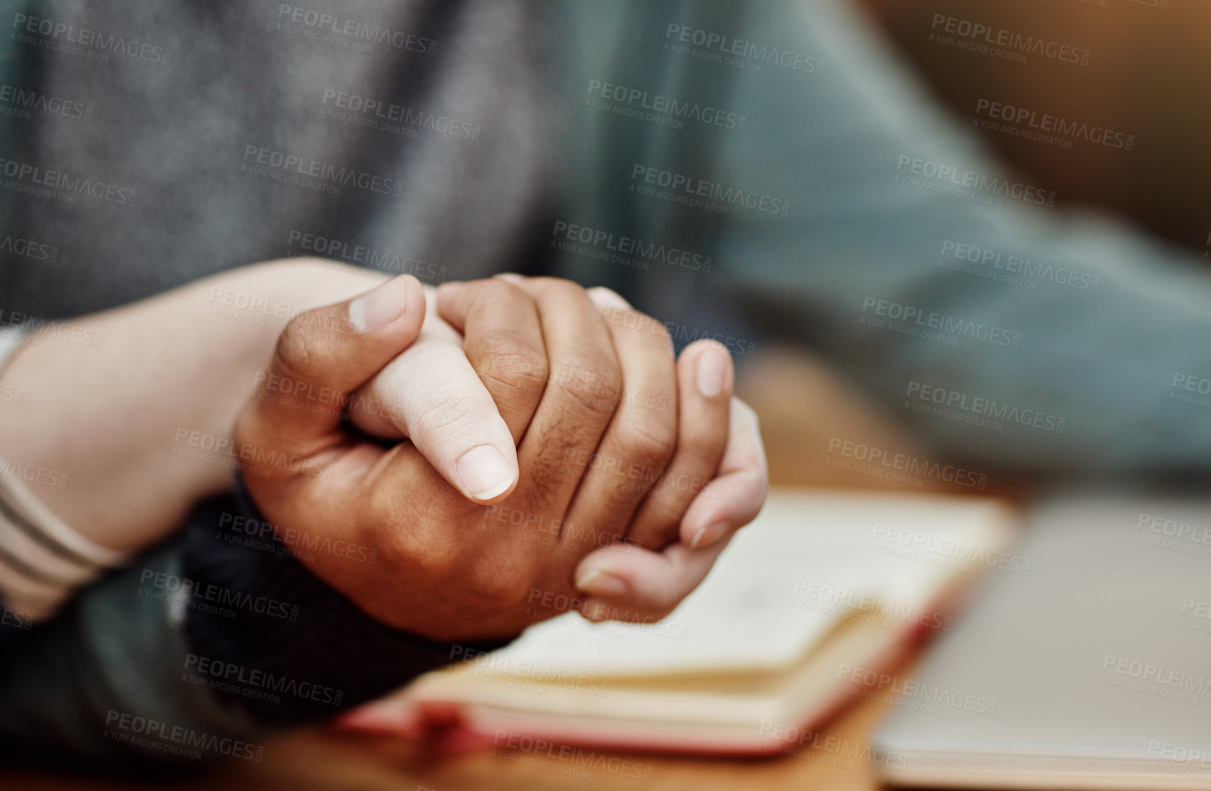 Buy stock photo Couple, bible study or holding hands at table for prayer, gratitude or worship with love. Religious group, spiritual gesture or meeting at table for learning, faith or trust in christian community