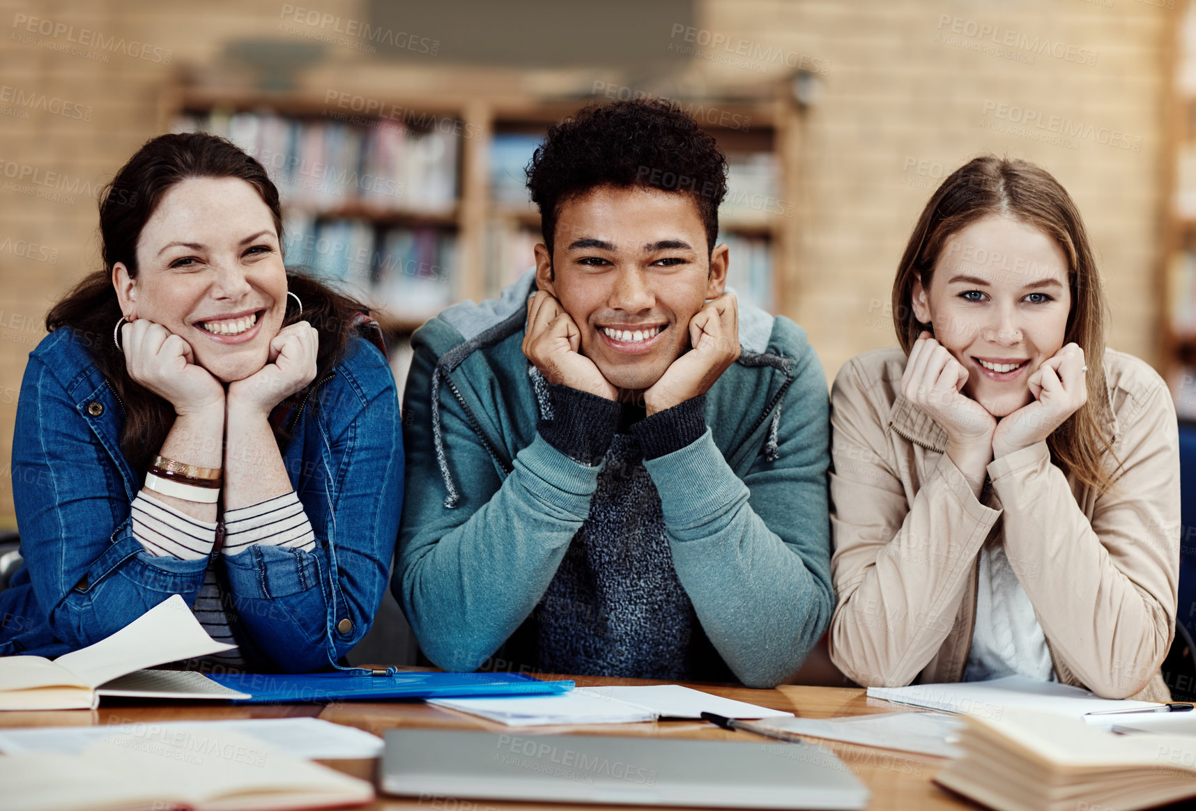 Buy stock photo Portrait, smile and group in library, education and proud of scholarship for college and learning. Studying, university students and happy with knowledge, confident and people in campus and books