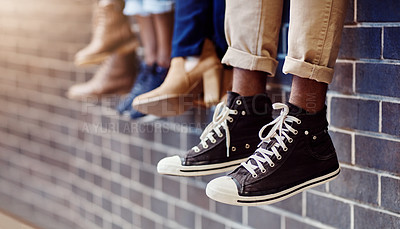 Buy stock photo Brick wall, student sneakers and friends outdoor on university campus together with shoes. Relax, youth and foot at college with people legs ready for education, study and urban feet while sitting