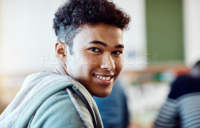 Buy stock photo Portrait of a young cheerful university student looking back over his shoulder at campus
