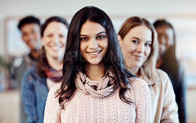 Buy stock photo Portrait of a group of confident young university students standing together at campus
