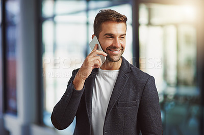 Buy stock photo Cropped shot of a handsome businessman talking on his cellphone