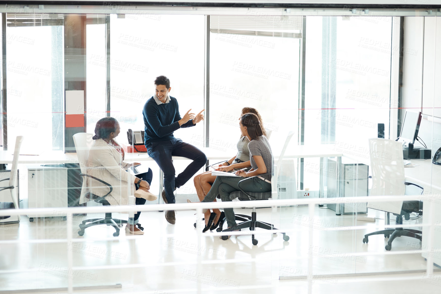 Buy stock photo Full length shot of a businessman giving a presentation during a meeting in the boardroom