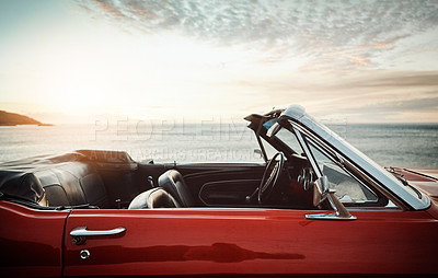 Buy stock photo Convertible, car and sunset at beach for transport with road trip, adventure and journey with mockup space. Empty vehicle, vintage and park on coast at seaside for ocean sunrise, travel and scenery