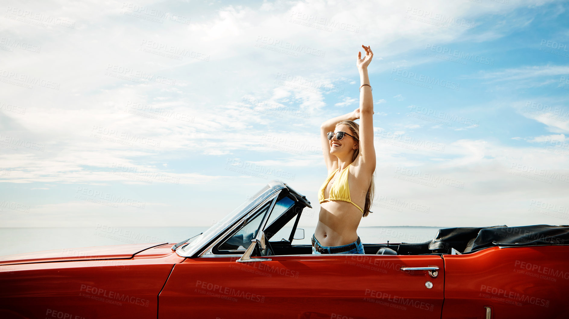 Buy stock photo Happy woman, celebrate and convertible car by beach for road trip, adventure and freedom on holiday or vacation alone. Young driver in cool trendy transport with dance, energy or travel mockup space