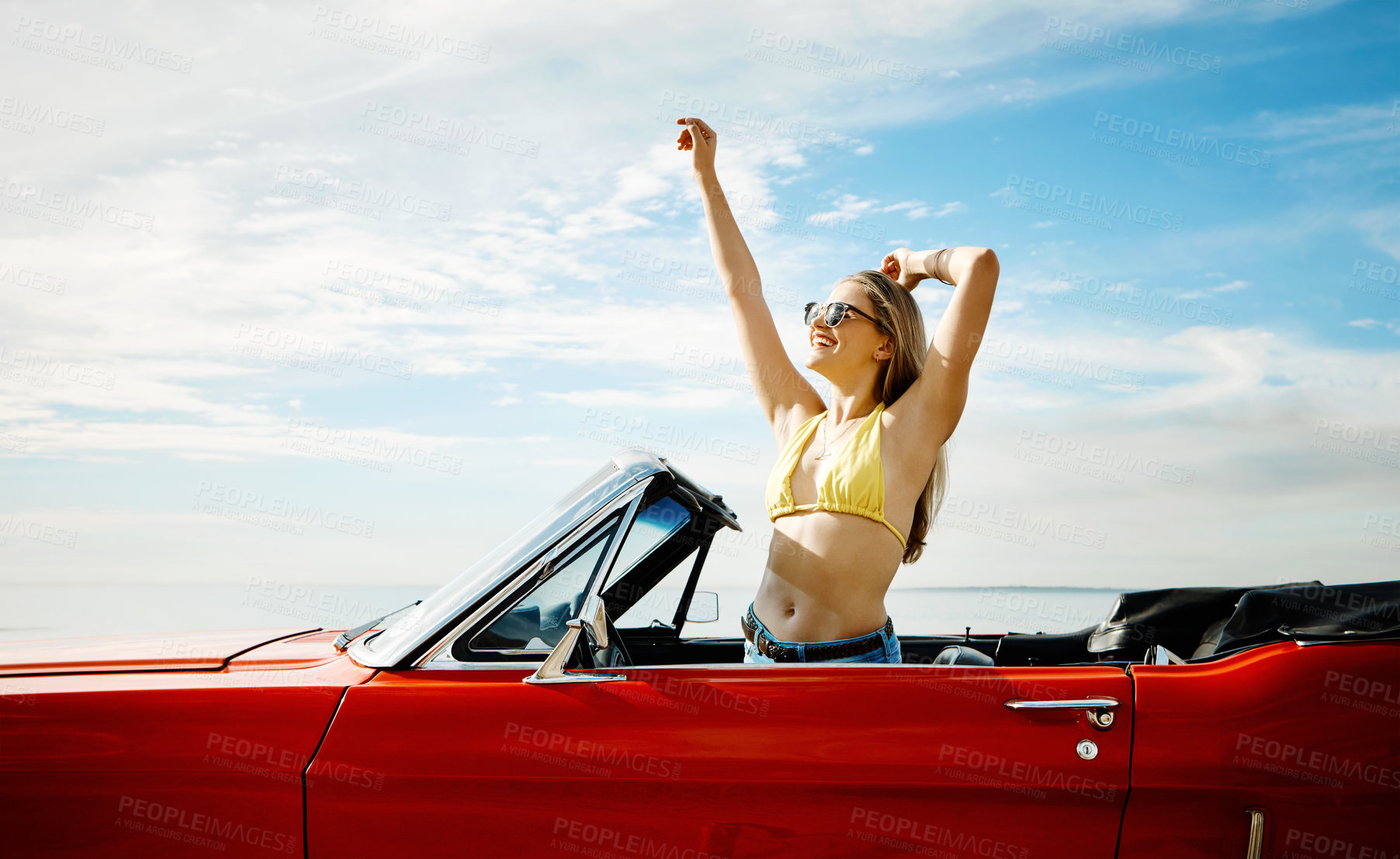 Buy stock photo Happy woman, celebration and dance in convertible car for road trip, adventure and freedom on holiday or vacation. Excited young driver in luxury vehicle with person, carefree and energy for travel